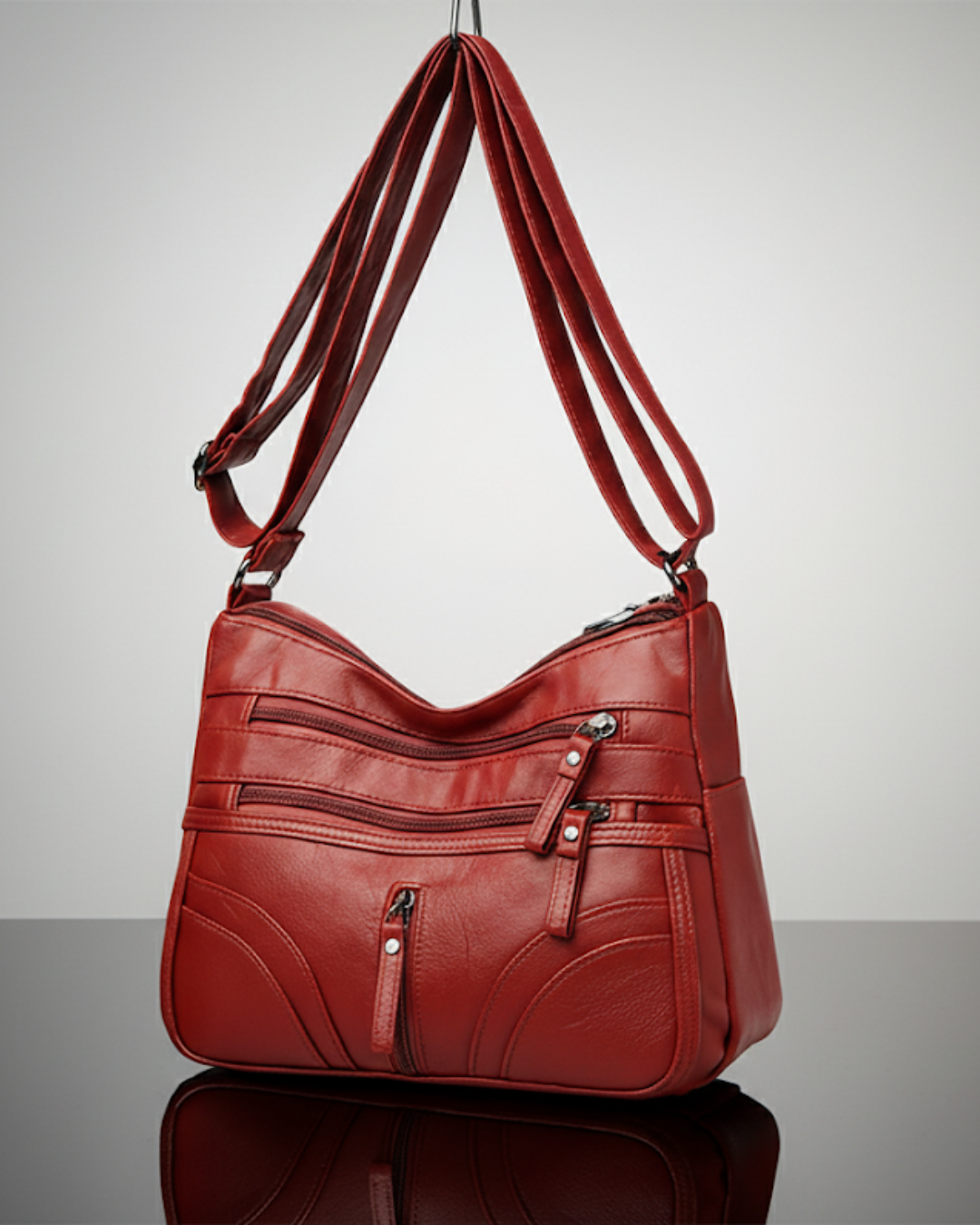 Bolso con múltiples compartimentos y textura suave®